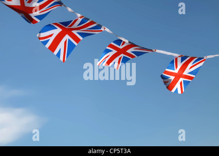 Jubilee United kingdom flags blowing in wind with blue sky background Stock Photo