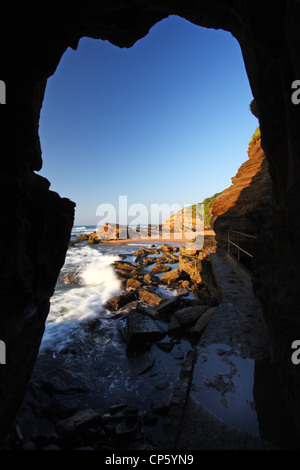 Hole in the rock cliff at Thompson's Bay, Ballito, Kwazulu Natal, South Africa Stock Photo