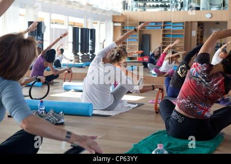 Relaxing and stretching class at the gym Stock Photo