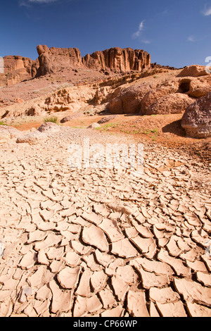 mud cracks in a dried up river bed in the Anti Atlas of Morocco, that is suffering from drought. Stock Photo