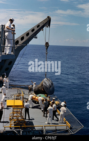 Gemini 5 spacecraft is brought aboard the recovery ship, U.S.S. Lake Champlain after a successful landing at the end of its miss Stock Photo