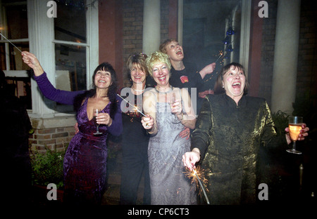 Women celebrating at Millennium new years party Uk Stock Photo