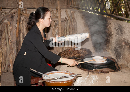 Vietnamese woman making rice paper, Ben Dinh, Cu Chi, near Ho Chi Minh City, (Saigon), Vietnam Stock Photo