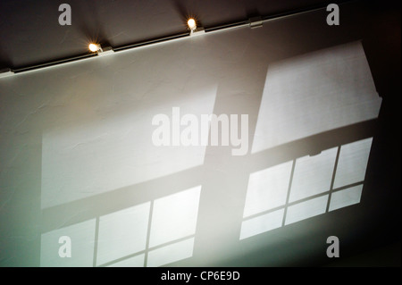 Reflections, shadows and window patterns cast on the vaulted ceiling of a home office. Stock Photo