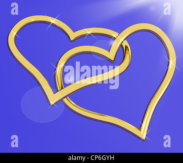 Gold Heart Shaped Rings On Blue Representing Loving And Romance Stock Photo