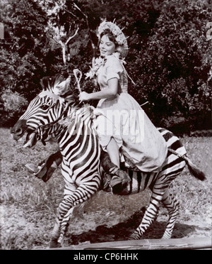 Actress Janet Munro Riding a Zebra Stock Photo