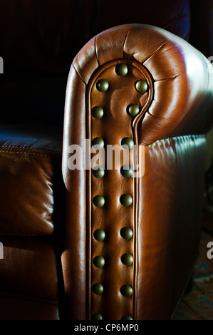 Close up photograph of sunlight on a fine leather recliner seat Stock Photo