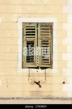 Old window with wooden shutters and rusty grille Stock Photo - Alamy