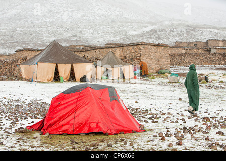 Trekkers camping in the Anti Atlas of Morocco in snow. Stock Photo