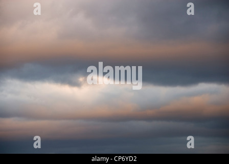 Cloudscape Blue and Pink Orange Cumulus Clouds of  Mid Winter Sunset, Sheffield, UK, Background Stock Photo