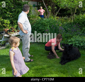 Three generations in a garden in the afternoon, Wroclaw, Poland Stock Photo