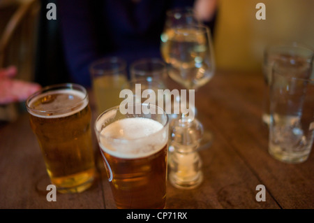 Table in a pub with drinks blurred Stock Photo