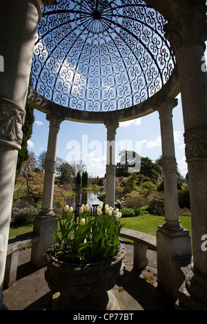 Cholmondeley Castle Gardens. Picturesque spring view of an arbour with the Temple Garden in the background. Stock Photo
