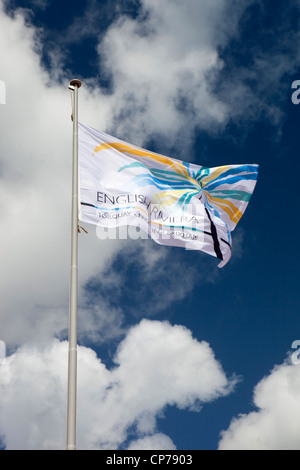 UK, England, Devon, Torquay, Goodrington Sands beach, English Riviera flag flying in blue sky Stock Photo