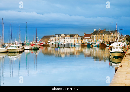 The Normandy fishing port of Saint-Vaast-La-Hougue on a calm summer evening at twilight. Stock Photo