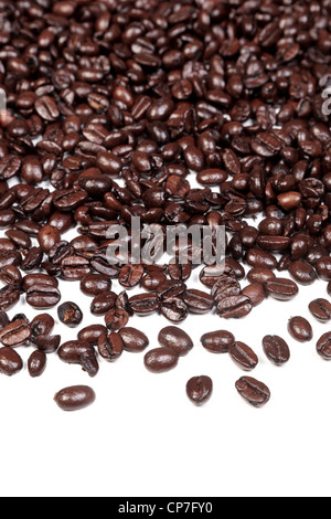 Photo of an Arabica and Robusta coffee beans mixture on a white background. Stock Photo