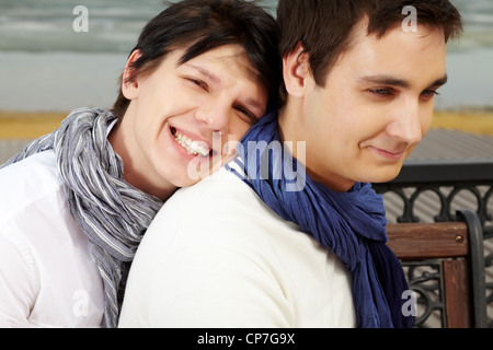 Portrait of smiling homosexual lovers dressed in elegant casual spending time outdoors Stock Photo