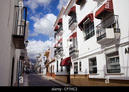Apartment houses residential architecture on cosy tranquil street in resort town of Nerja, Andalusia region, southern Spain Stock Photo