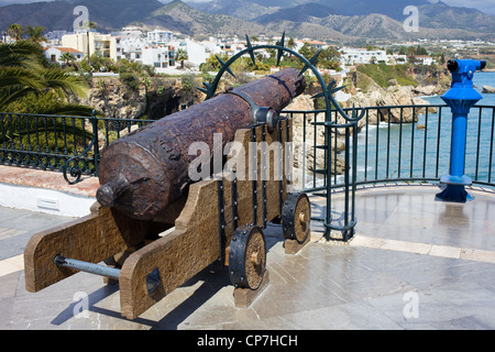 An old medieval cannon aimed at Mediterranean Sea at the Balcon de Europa in Nerja town, Spain Stock Photo