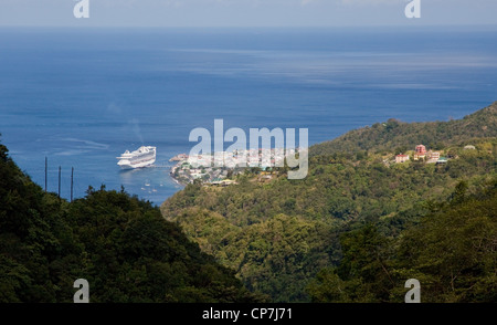 Roseau the capital of Dominica dwarfed by the Dawn Princess cruise ship arriving in port Stock Photo