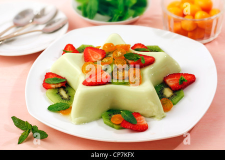 Panacotta with fruits and mint. Recipe available. Stock Photo