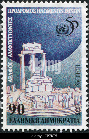 A stamp printed in Greece, is dedicated to the 50th anniversary of the UN, shows Tholos temple in Delphi, circa 1995 Stock Photo
