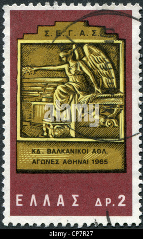 GREECE - CIRCA 1965: Postage stamps printed in Greece, dedicated to the 24th Balkan Games, shows Victory Medal, circa 1965 Stock Photo
