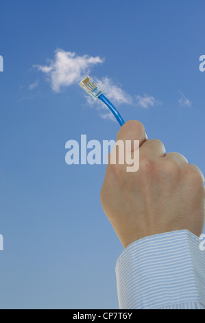 Ethernet cable connecting into cloud Stock Photo