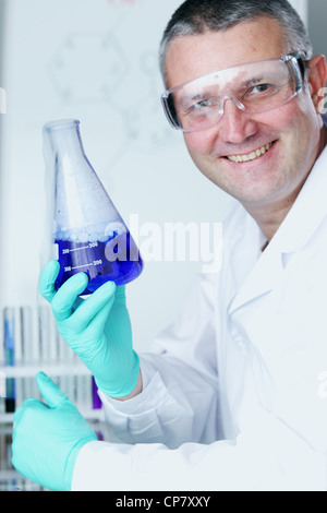 Chemistry Scientist conducting experiments in laboratory Stock Photo