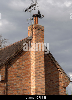 A satellite dish and TV arial Stock Photo