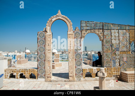 Tunis, Tunisia - Traditionally tiled terrace of Palais d'Orient with ornamental arches and wall covered tiles. Stock Photo