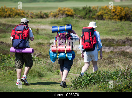 Walkers at Three Cliffs Bay Gower South Wales Stock Photo