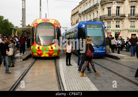 Two modern trams - streetcars - in the main square of Montpellier, southern France Stock Photo