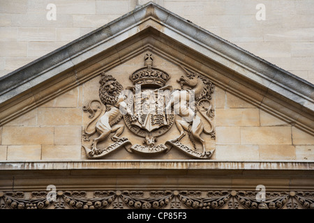 Lion / Unicorn coat of arms carving on the University of Oxfords Examination Schools Building. Oxford, Oxfordshire, England Stock Photo