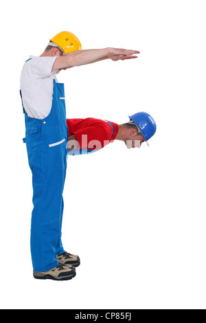 Tradesmen forming the letter F Stock Photo