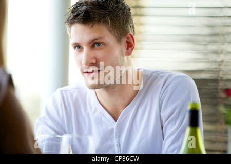 Portrait of an attractive guy seriously listening to someone Stock Photo