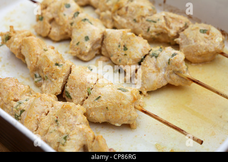 A bowl of chicken tikka skewers fresh from the grill Stock Photo