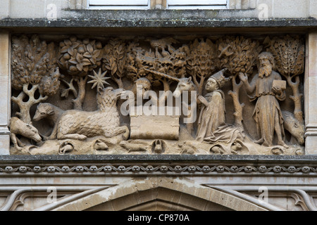 St john the baptist stone carved panel on the exterior of Merton College, Oxford University. Oxford, Oxfordshire, England Stock Photo