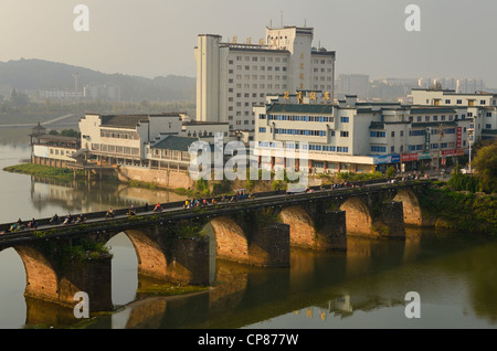 Morning rush on Ming Dynasty Zheng Hai bridge over Xinan river in Huangshan City formerly Tunxi Peoples Republic of China Stock Photo