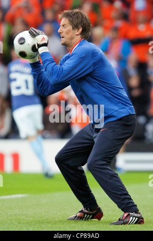 Goalkeeper Edwin van der Sar of the Netherlands saves the ball during team warmups before Euro 2008 soccer match against France. Stock Photo