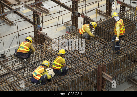 Steel fixers working on construction site in Central district of Hong Kong Stock Photo