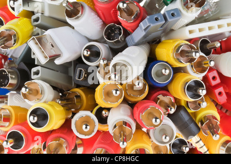 Blue, yellow, white, red, gray digital connectors for modern video audio equipment macro background Stock Photo