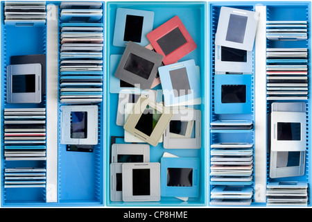 Blue boxes with old dusty negatives and slides background Stock Photo