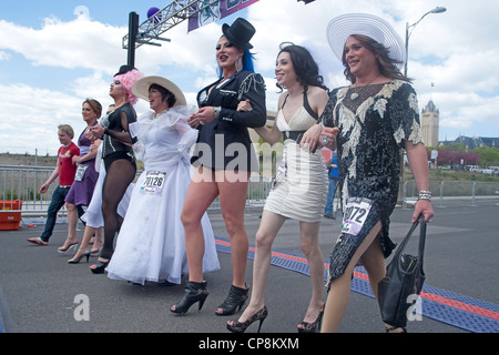 Spokane, Washington - May 6, 2012. Local drag queens walk the entire 7 1/2 miles in high heels at the bloomsday race. Stock Photo