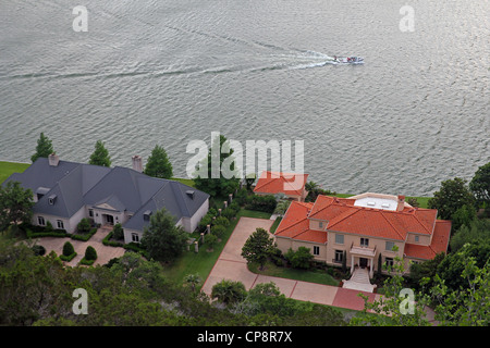 A boat and mansions on the Colorado River, viewed from above. Stock Photo