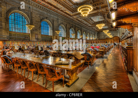 People work, study, and read in the Rose Main Reading Room in the main branch of the New York Public Library in New York City. Stock Photo