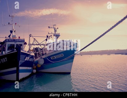 traditional fishing boats moored at the pier of Cancale, oyster capital on the north coast of Brittany Stock Photo