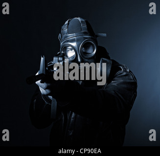 terrorist with gasmask dark background Stock Photo