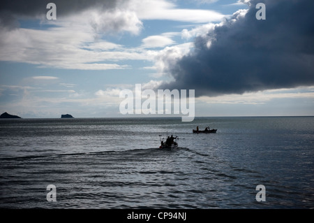 fishing boat leaving Paignton harbour Devon,Brixham Harbour,Trawler Fleet,Devon,at the seaside,storm brewing, abstract, backgrou Stock Photo