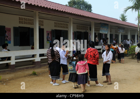 Lao school children during a presentation of books and stationary by tourists Ziemg Khuang Province Northern Laos Stock Photo